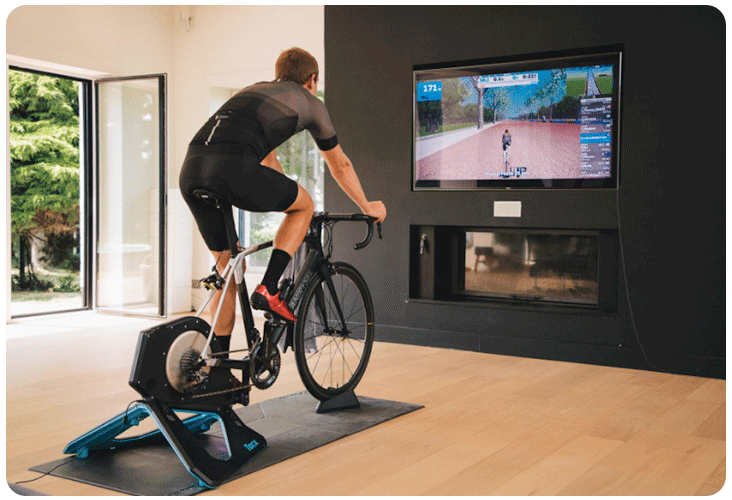 Home trainer Tacx NEO 2T Smart avec un Van Rysel sur Zwift 